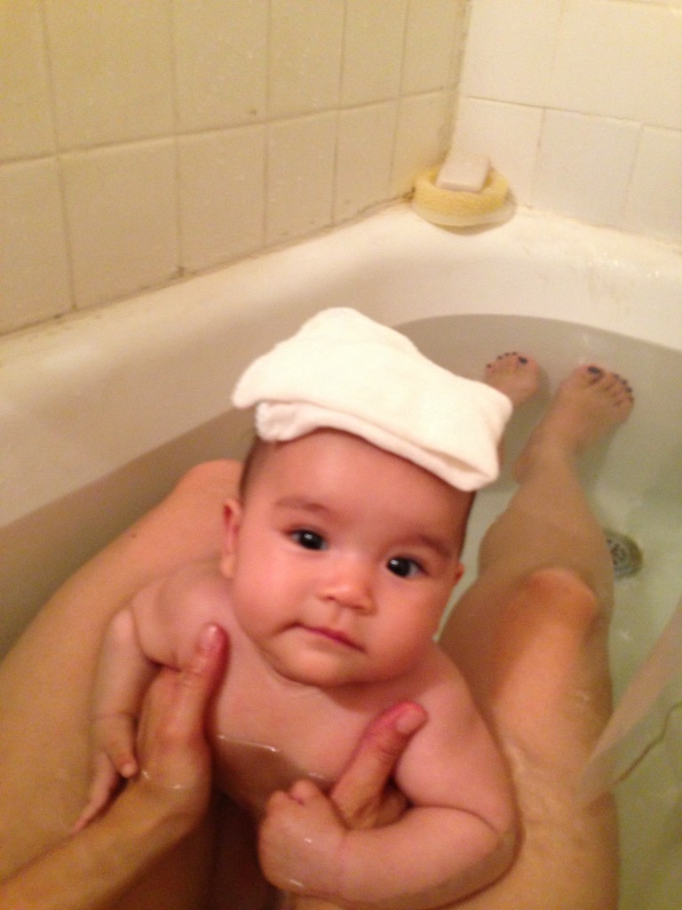 How Momo keeps her towel dry while bathing.