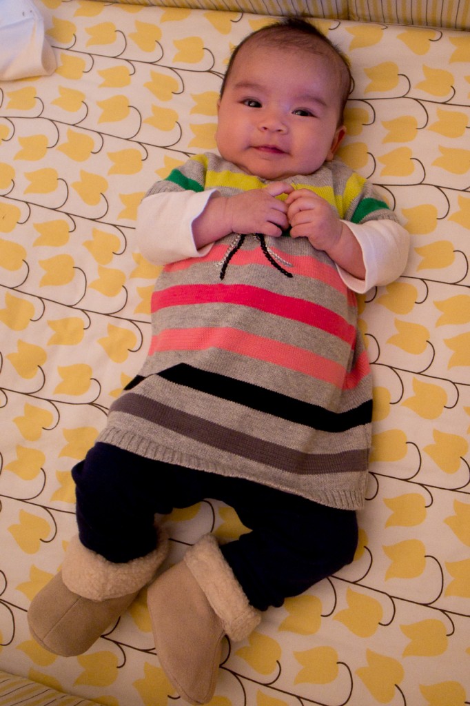 Momo in a dress and booties.
